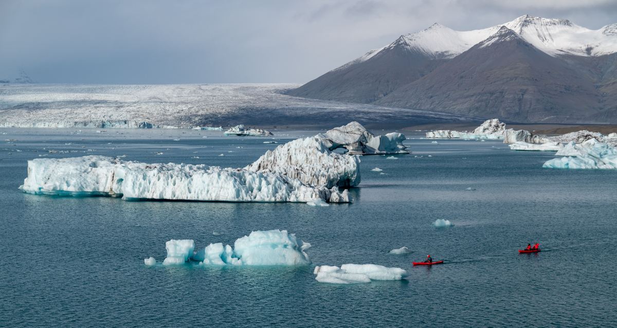 Glacier Lagoon With Boaters
